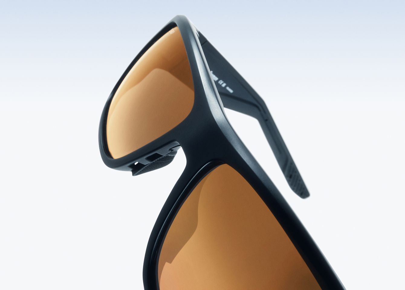 A VIVID, CRYSTAL-CLEAR VISUAL EXPERIENCE-Offered in a lighter VLT which gives the lens more range under varying light conditions and aesthetically differentiated by a gold mirror treatment